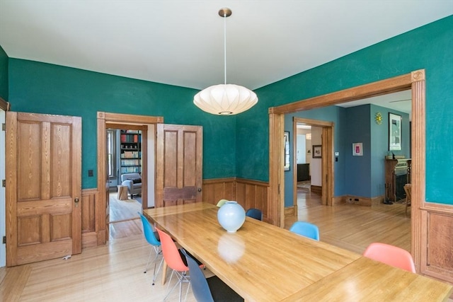 75 Lyman Rd, Northampton, MA 01060 - dining space featuring wainscoting, wood finished floors, and wood walls