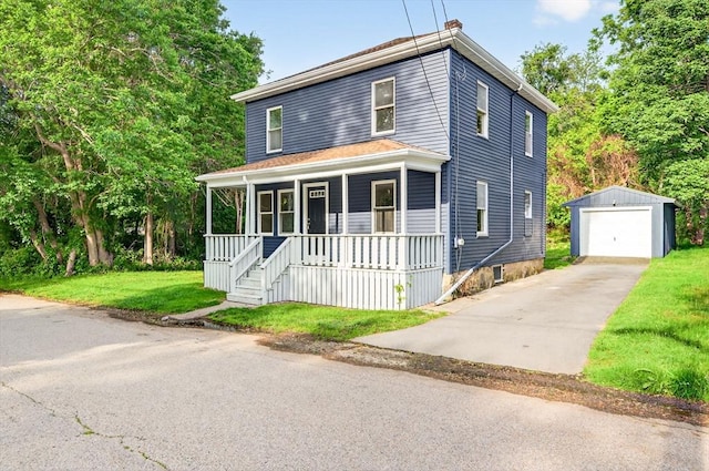 51 Ryder St, Dartmouth, MA 02747 - american foursquare style home with an outbuilding, driveway, a porch, a detached garage, and a front yard