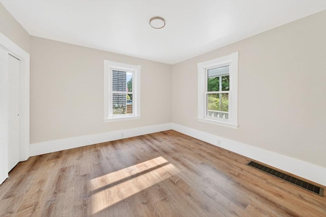 51 Ryder St, Dartmouth, MA 02747 - empty room with healthy amount of natural light and wood finished floors