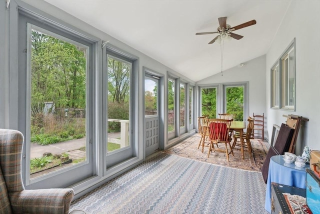 sunroom featuring vaulted ceiling