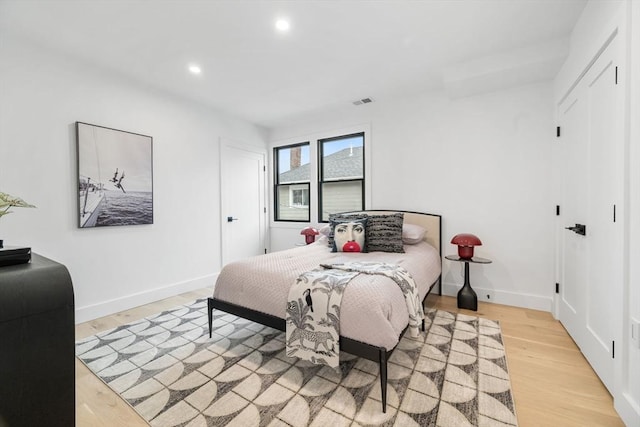 bedroom with light hardwood / wood-style flooring