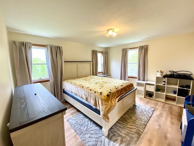 bedroom featuring light wood-style flooring