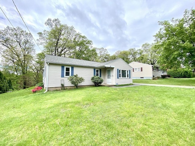 ranch-style house with a front lawn