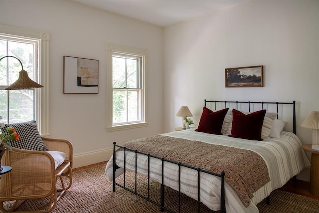 24 Foster St, Cambridge, MA 02138 - bedroom featuring baseboards and wood finished floors