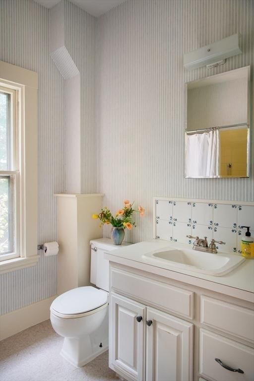 24 Foster St, Cambridge, MA 02138 - full bath with wallpapered walls, vanity, and a shower with shower curtain