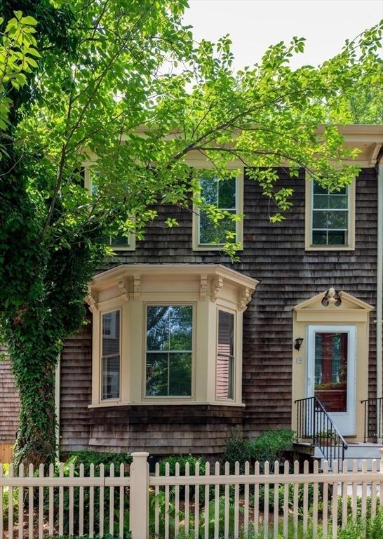 24 Foster St, Cambridge, MA 02138 - view of front of home with a fenced front yard