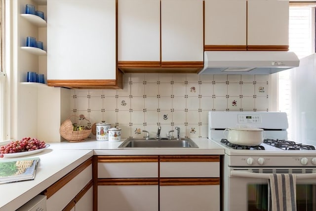 24 Foster St, Cambridge, MA 02138 - kitchen with white range with gas stovetop, ventilation hood, light countertops, tasteful backsplash, and open shelves