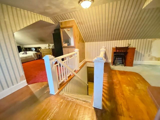 bonus room featuring lofted ceiling and hardwood / wood-style flooring