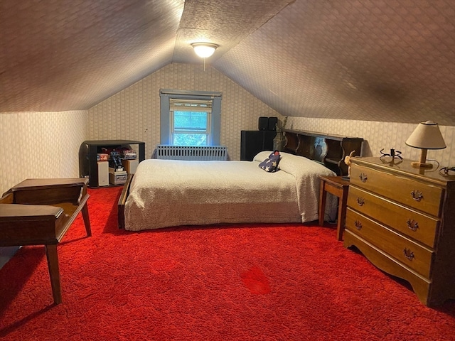 carpeted bedroom featuring vaulted ceiling