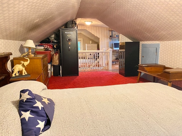 carpeted bedroom featuring vaulted ceiling