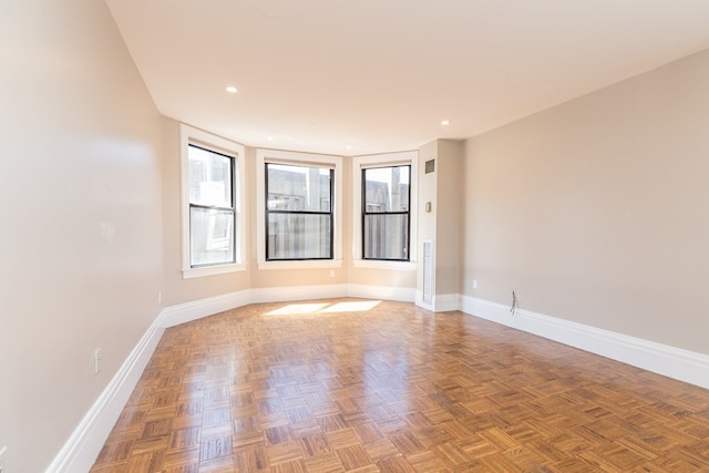 unfurnished room with parquet floors