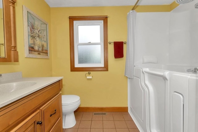 bathroom with baseboards, tile patterned floors, a shower with shower curtain, toilet, and vanity