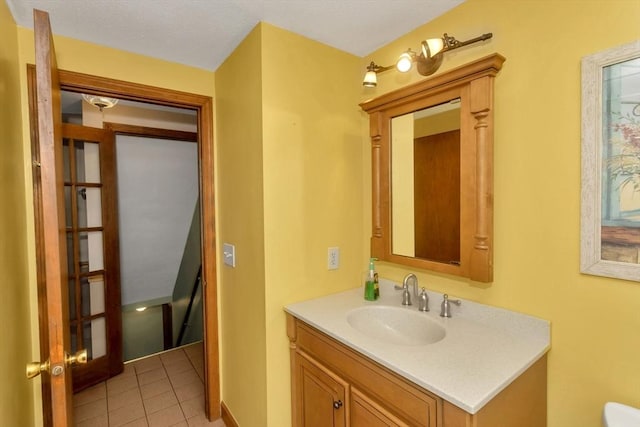 bathroom with tile patterned flooring and vanity