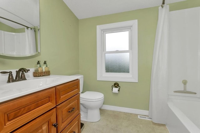 bathroom with baseboards, toilet, and vanity