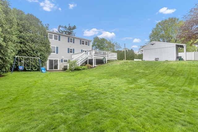 view of yard featuring a wooden deck and stairs