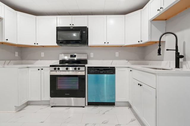 kitchen with white cabinets, stainless steel appliances, and sink