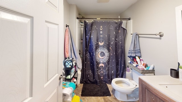 full bathroom featuring shower / bathtub combination with curtain, vanity, and toilet