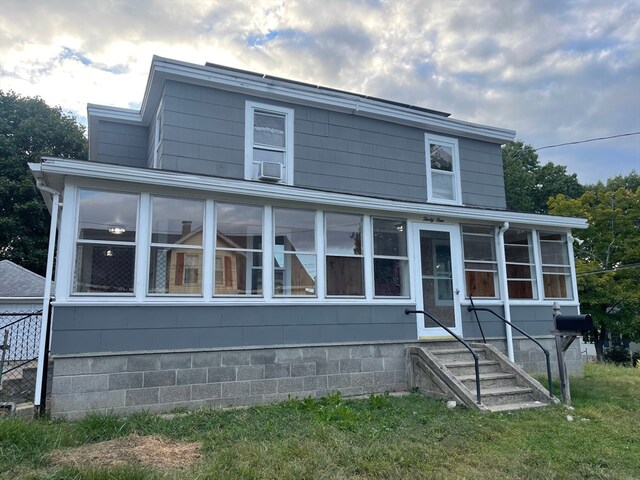 view of front facade featuring a sunroom