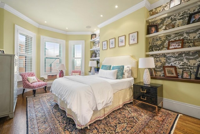 bedroom with ornamental molding and dark hardwood / wood-style flooring