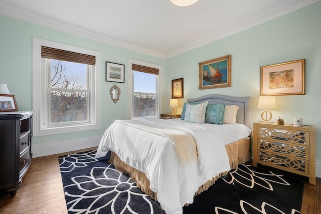 bedroom featuring dark wood-type flooring and crown molding