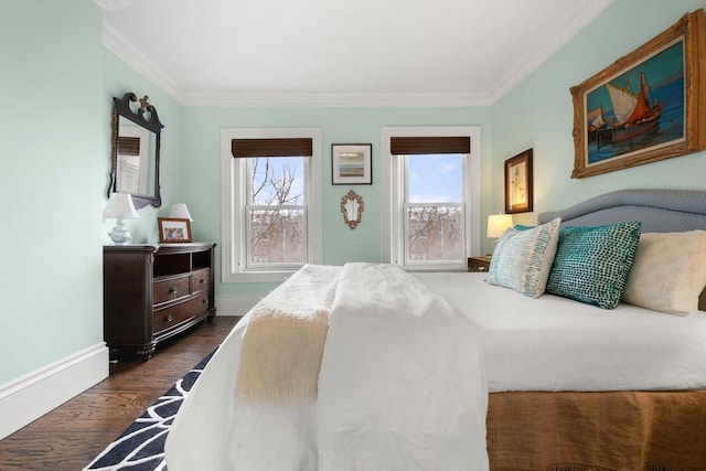 bedroom with dark hardwood / wood-style floors and ornamental molding