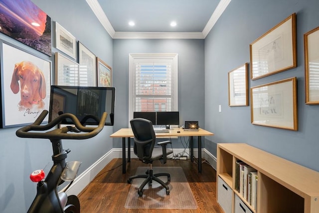 home office with ornamental molding and dark hardwood / wood-style flooring