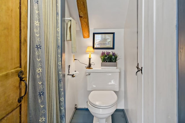 bathroom featuring tile patterned flooring and toilet