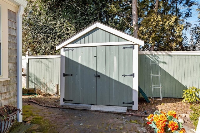 view of shed with a fenced backyard