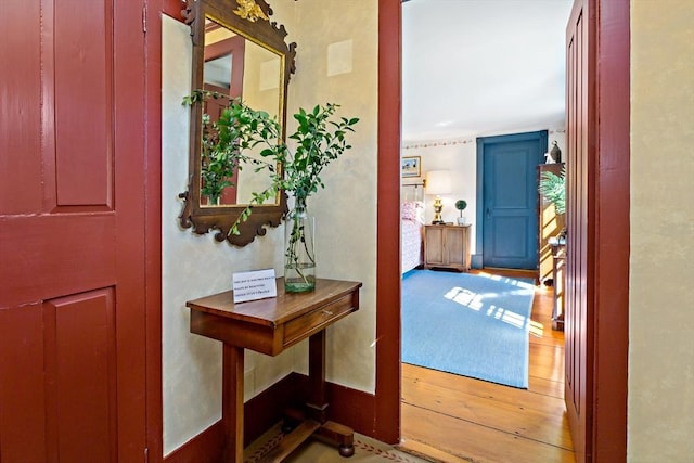 entryway with wood finished floors