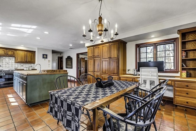 dining room with recessed lighting and an inviting chandelier