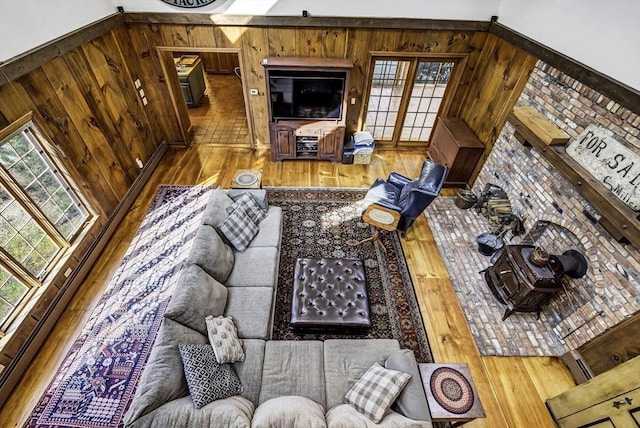 living area featuring wood finished floors and wood walls