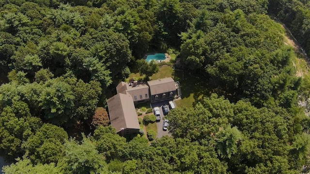 birds eye view of property with a wooded view