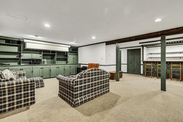 living area featuring recessed lighting, beam ceiling, and light colored carpet