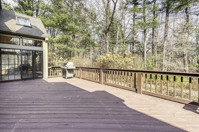 wooden deck featuring area for grilling