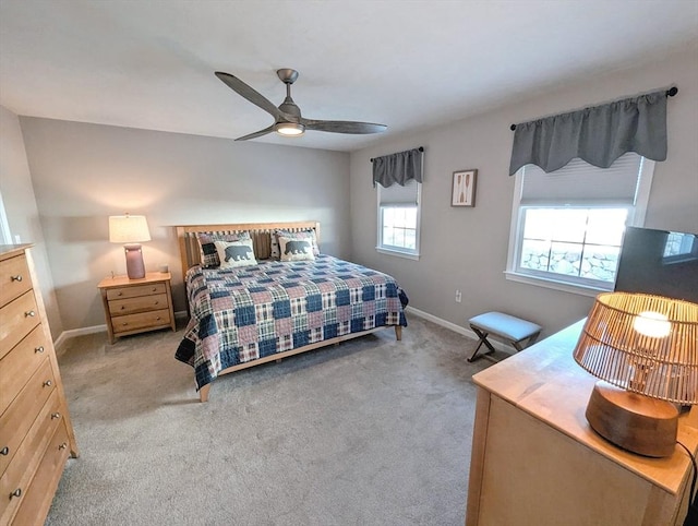 bedroom with carpet, a ceiling fan, and baseboards