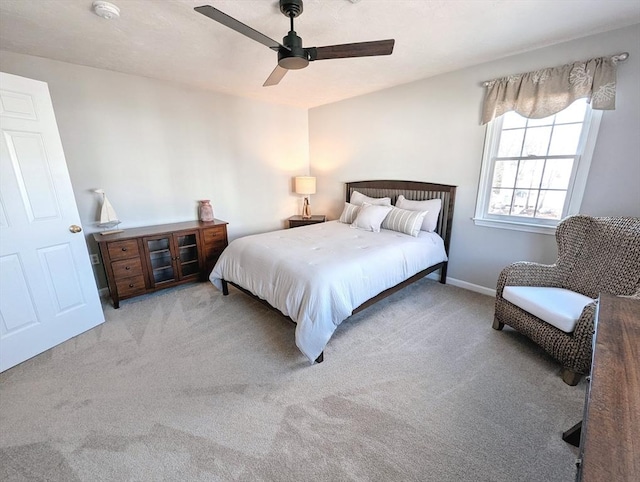 bedroom with carpet flooring, ceiling fan, and baseboards