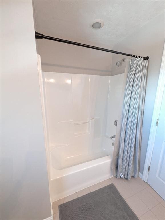 full bath featuring shower / bath combo and tile patterned floors