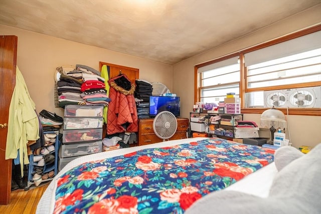 bedroom with light hardwood / wood-style floors