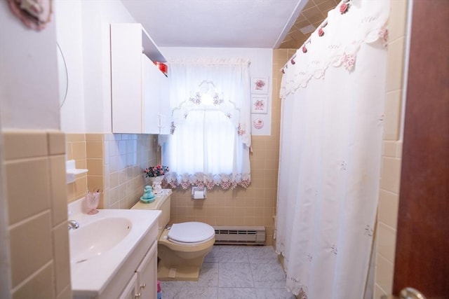 bathroom featuring toilet, vanity, tile walls, a shower with curtain, and a baseboard radiator