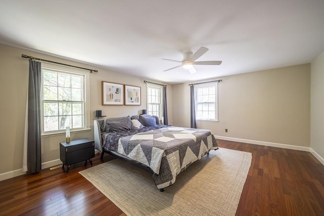 bedroom with baseboards, dark wood-style flooring, and ceiling fan