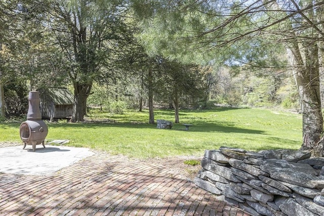 surrounding community featuring a patio and a yard
