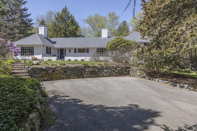ranch-style house with a chimney