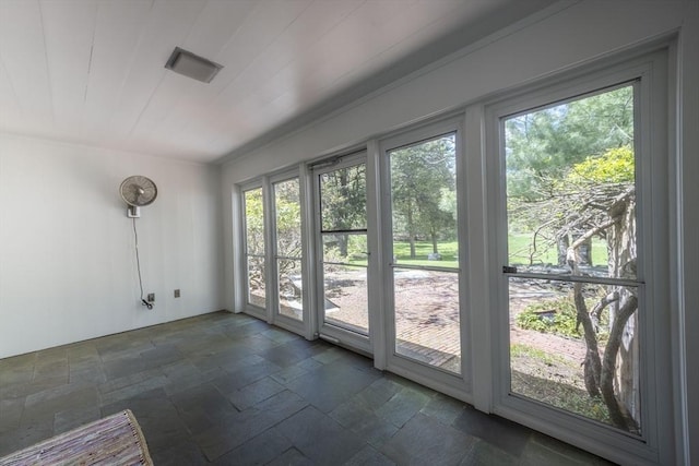 doorway with stone tile flooring
