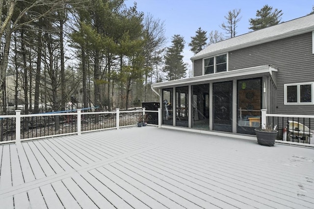 wooden deck featuring a sunroom