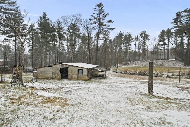 snowy yard with an outdoor structure