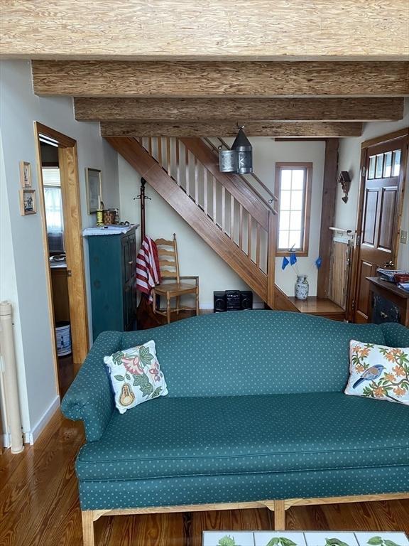 40 Provincetown View Rd, Plymouth, MA 02360 - living room with beamed ceiling, radiator heating unit, and dark hardwood / wood-style flooring