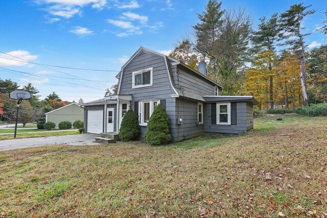 view of front property with a front yard and a garage