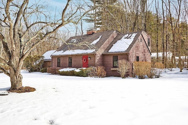 single story home featuring a chimney