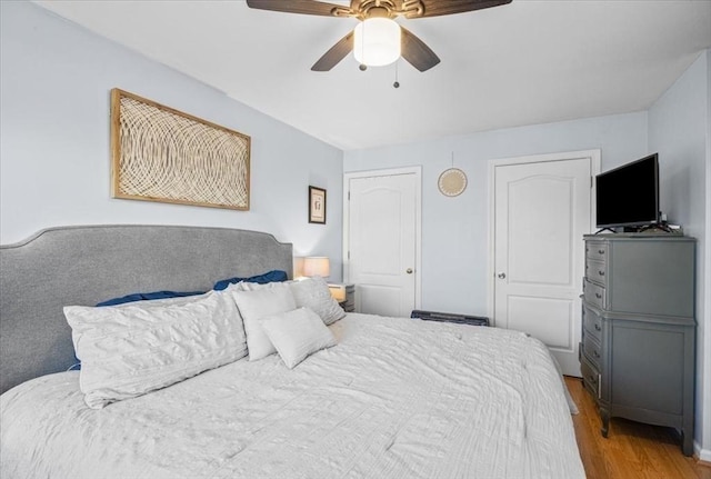 bedroom featuring wood finished floors and a ceiling fan