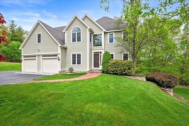 17 Fiddleneck Ln, Southborough, MA 01772 - view of front of property featuring a garage, driveway, and a front lawn